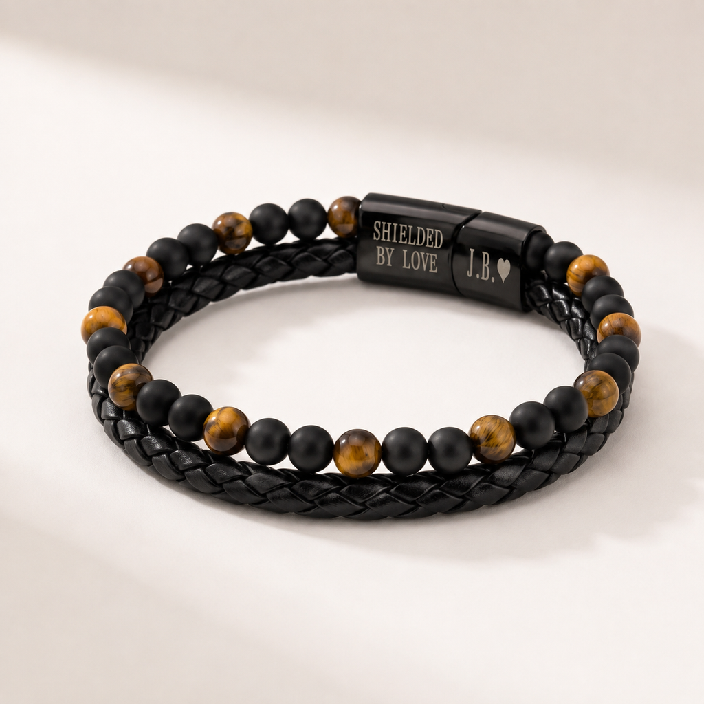 Close-up of the tiger eye and black onyx beads and the engraved Shielded By Love clasp