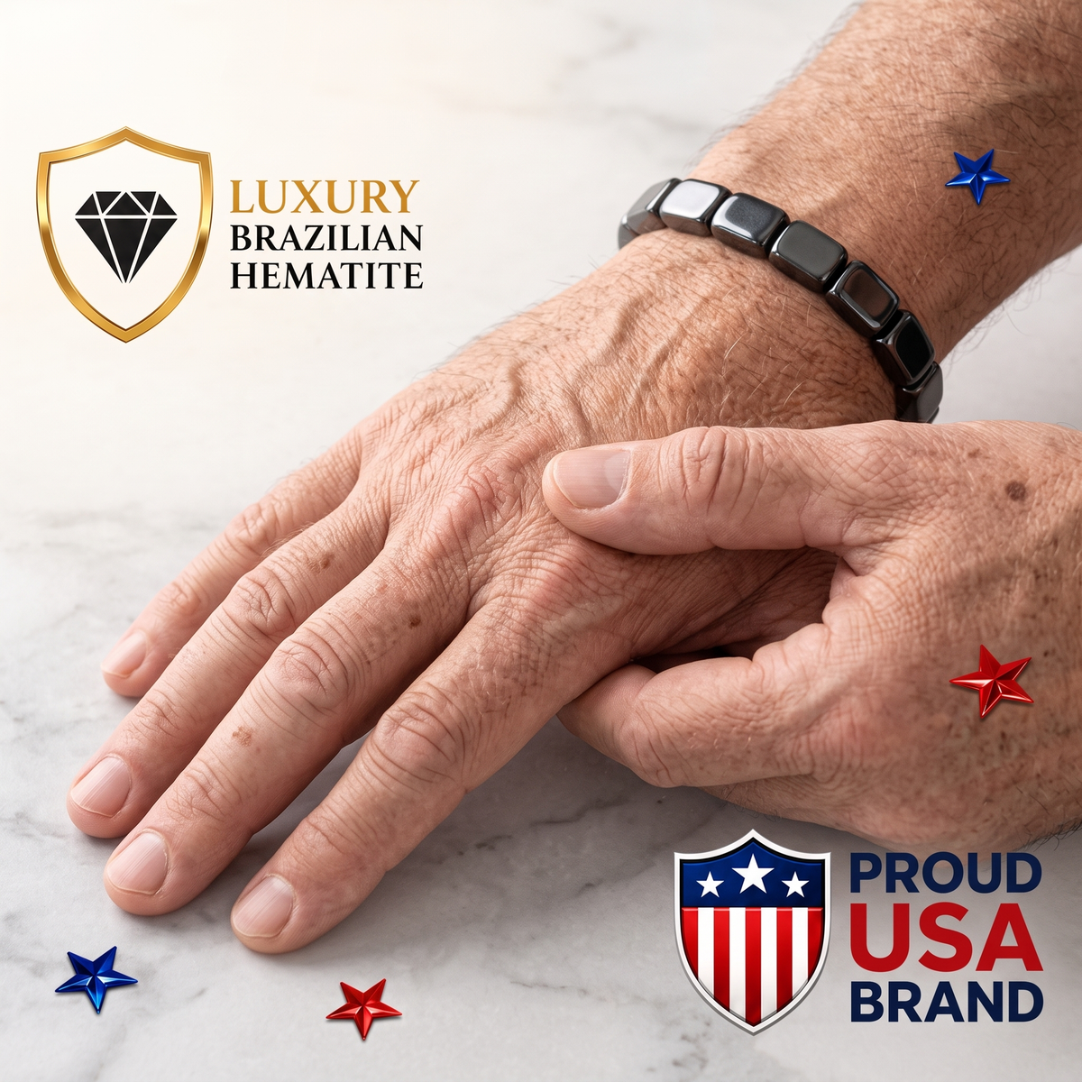 Mortive Hematite Hand-Comfort Bracelet on older male hand resting on marble