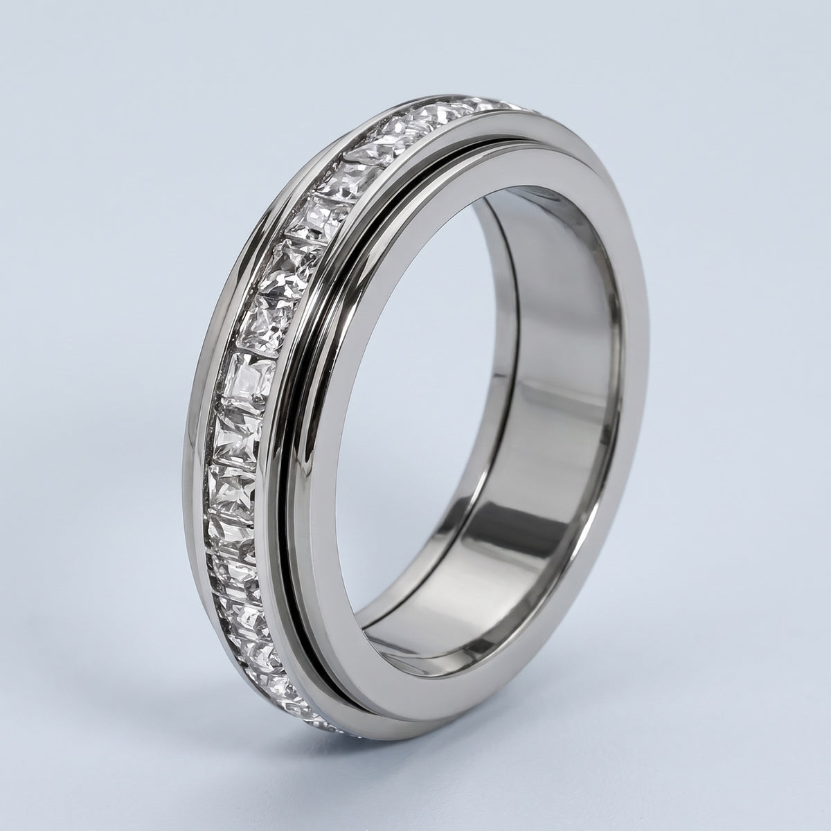 Calm Spinner Ring – silver finish with sparkling square CZ channel, 3/4 view