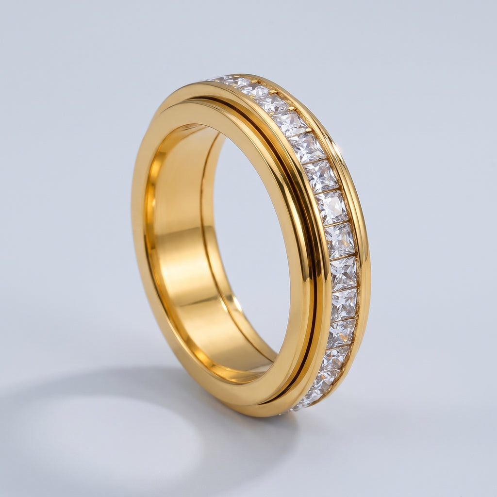 Calm Spinner Ring – golden (yellow gold tone) finish with square CZ channel