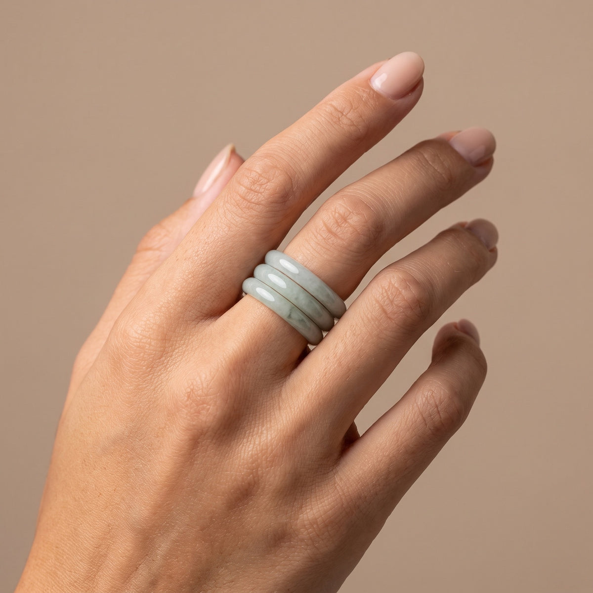 Jade Stacking Ring – three slim jade rings stacked on one finger