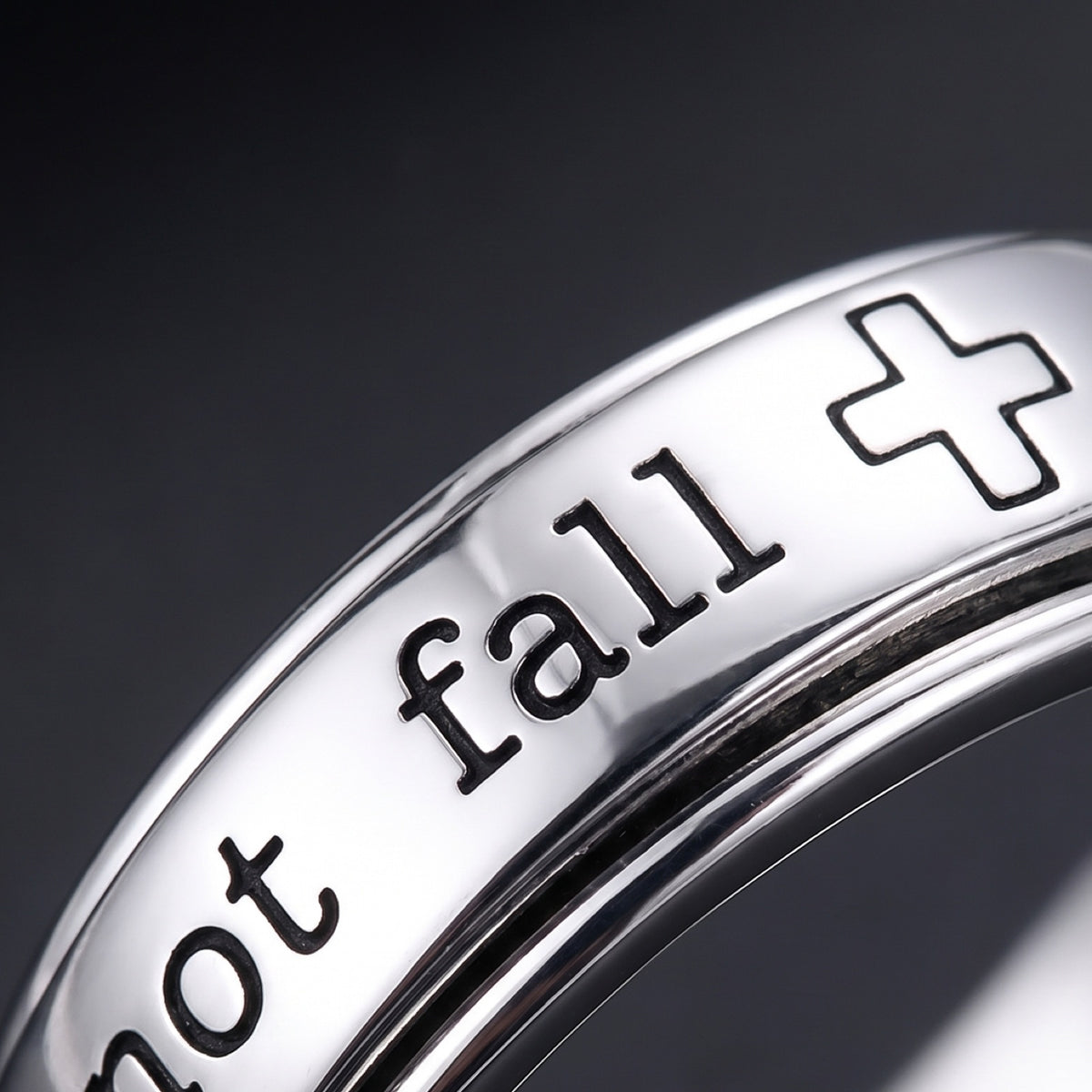 Psalm 46:5 Spinner Ring – close-up of the engraved words "not fall" and the cross
